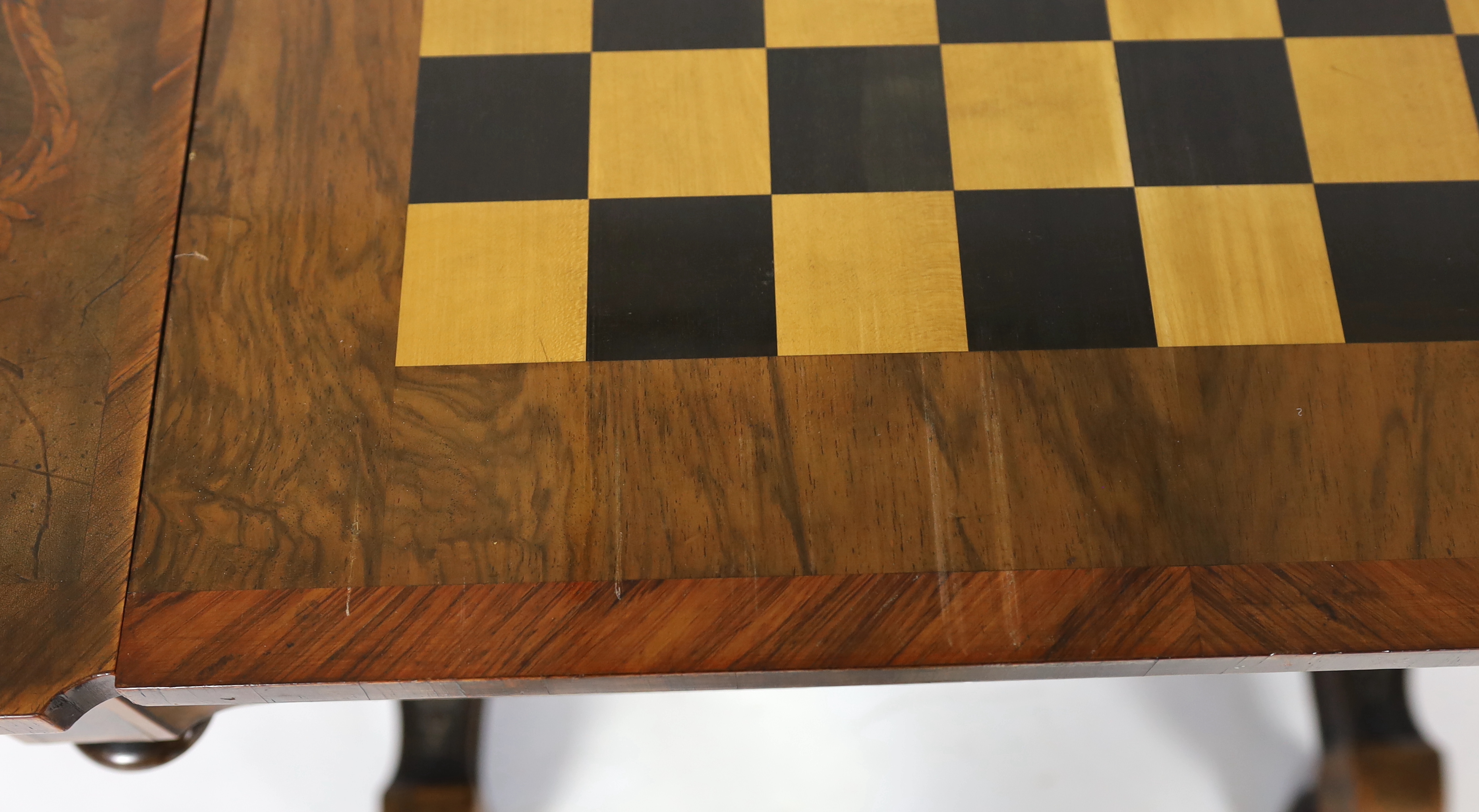 A 19th century French floral marquetry and tulipwood banded games table, 89cm wide, 58cm deep, 72cm high, Please note this lot attracts an additional import tax of 5% on the hammer price